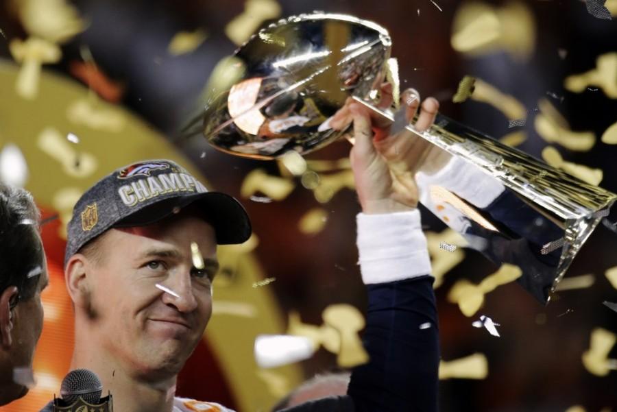 Denver Broncos’ Peyton Manning holds up the trophy after the NFL Super Bowl 50 football game Sunday, Feb. 7, 2016, in Santa Clara, Calif. The Broncos won 24-10. (AP Photo/Matt York)