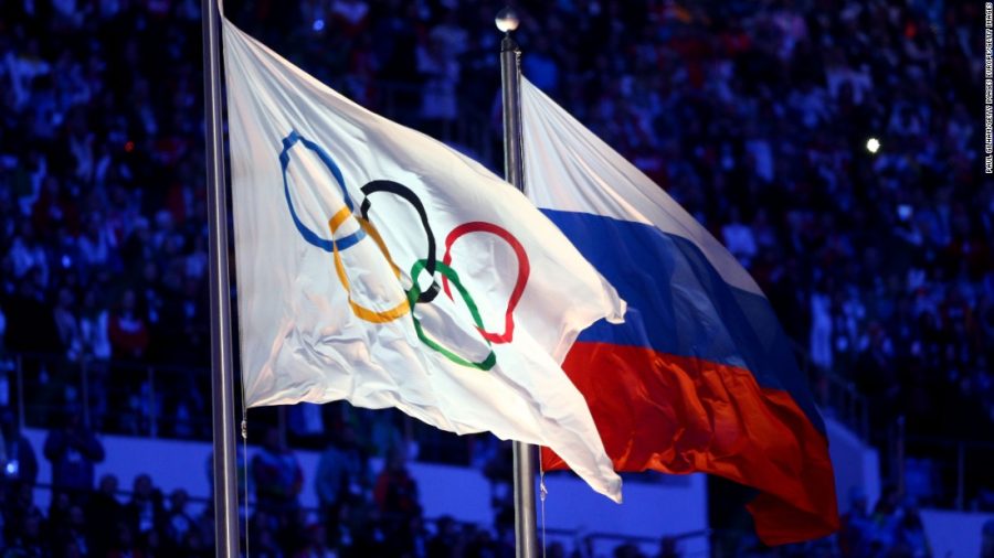 Above: Olympic and Russian flags side by side. Athletes will not be permitted to represent Russia in the upcoming Winter Games in February. 