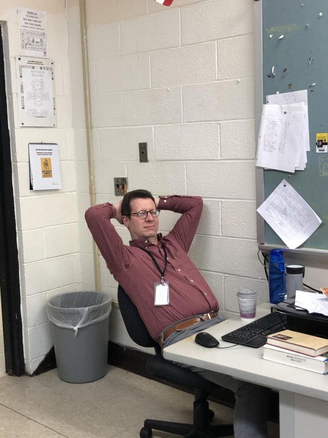 Above: Nitkinas sits peacfully in his chair,basking in the chaos he created,  watching the world burn over the spoon game.  Photo Courtesy: Patrick Babbitt