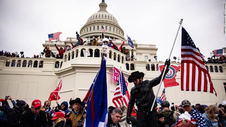 WASHINGTON, DC - JANUARY 06: Pro-Trump supporters storm the U.S. Capitol following a rally with President Donald Trump on January 6, 2021 in Washington, DC. Trump supporters gathered in the nations capital today to protest the ratification of President-elect Joe Bidens Electoral College victory over President Trump in the 2020 election. (Photo by Samuel Corum/Getty Images)