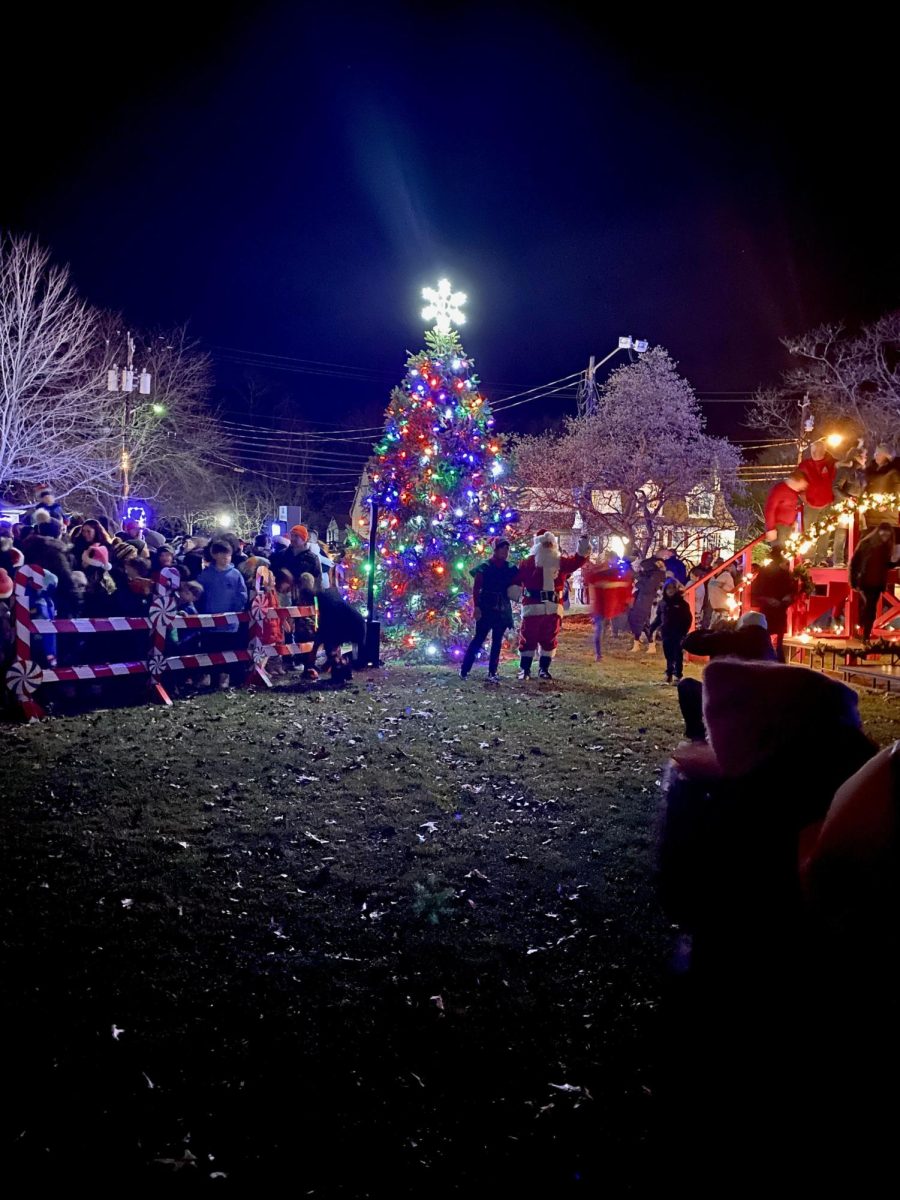 Santa Claus greets town residents following the annual lighting of the Christmas tree.