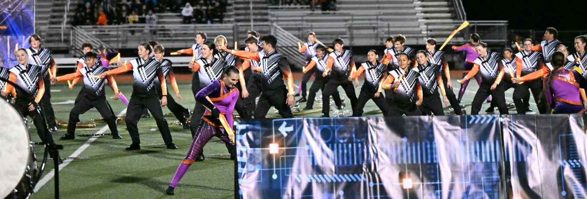 The band performs their show "High Voltage".  